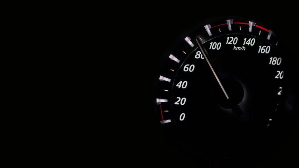 Speedometer reading showing speed in km/h on a dark background.